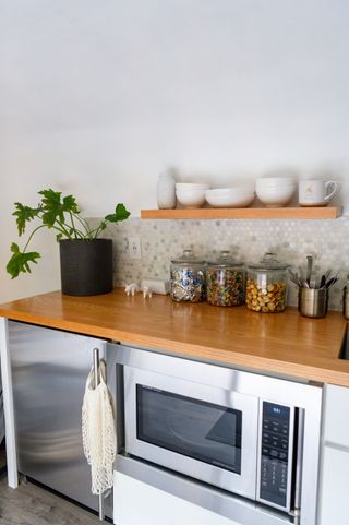 Microwave under wooden countertop
