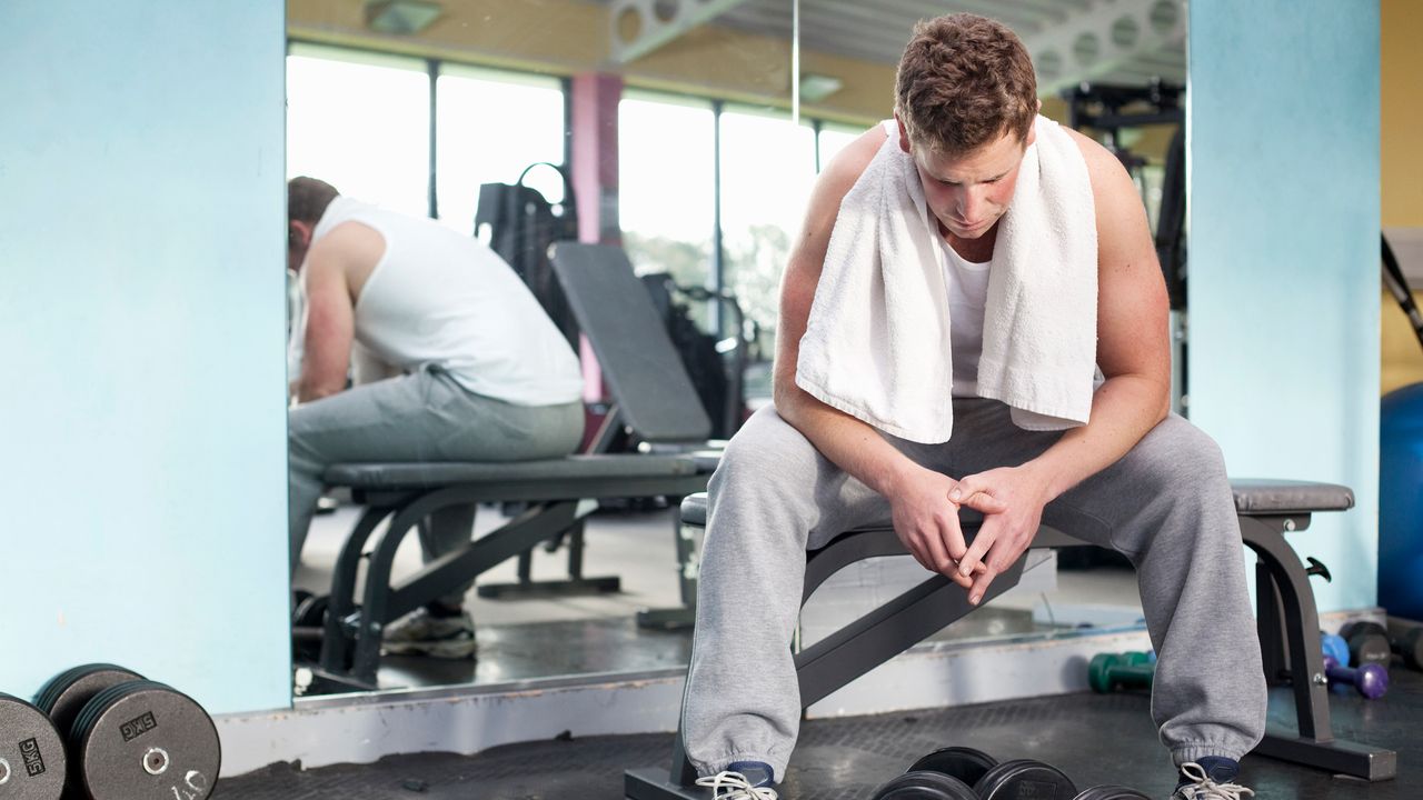 Man looking anxious in the gym