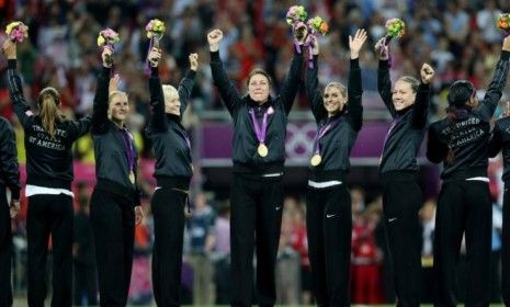 The U.S. women&amp;#039;s soccer team poses with gold medals after defeating Japan by a score of 2-1 at the London Games on Aug. 9.