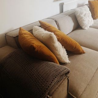 sofa with brown and white cushions