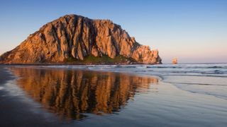 Morro Rock, California, with reflection in water