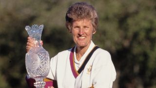 Kathy Whitworth with the trophy after the US won the inaugural Solheim Cup in Florida