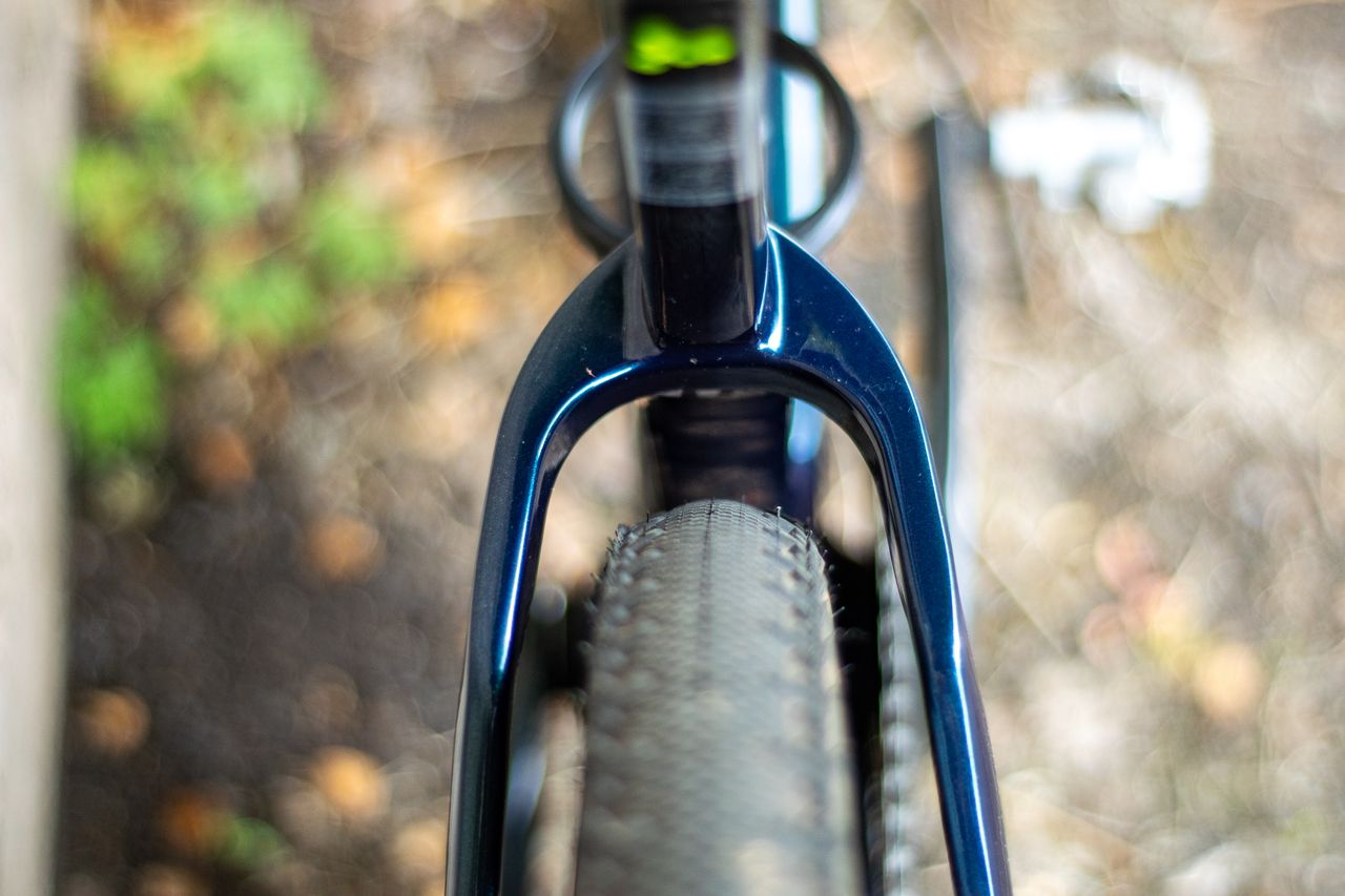 An Argon 18 Anti Matter gravel bike leaning against a concrete wall.
