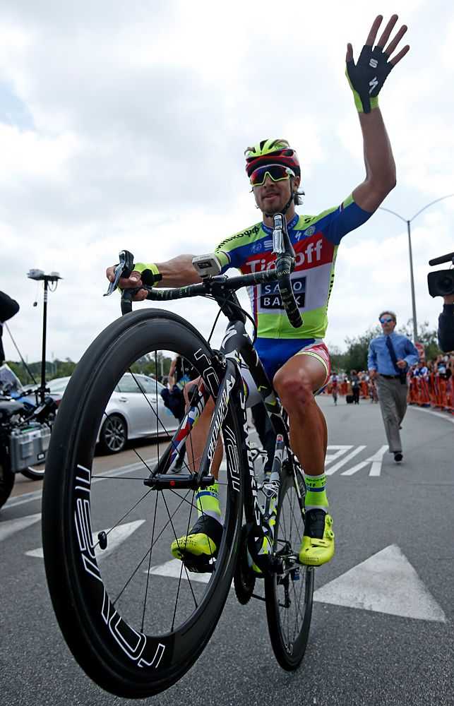Peter Sagan (Tinkoff-Saxo) wheelies in celebration of his overall win