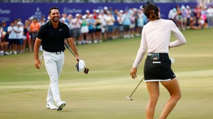 Jason Day of Australia react as Lydia Ko of New Zealand putts to clinch their win on the 18th green during the final round of the Grant Thornton Invitational at Tiburon Golf Club on December 10, 2023 in Naples, Florida.