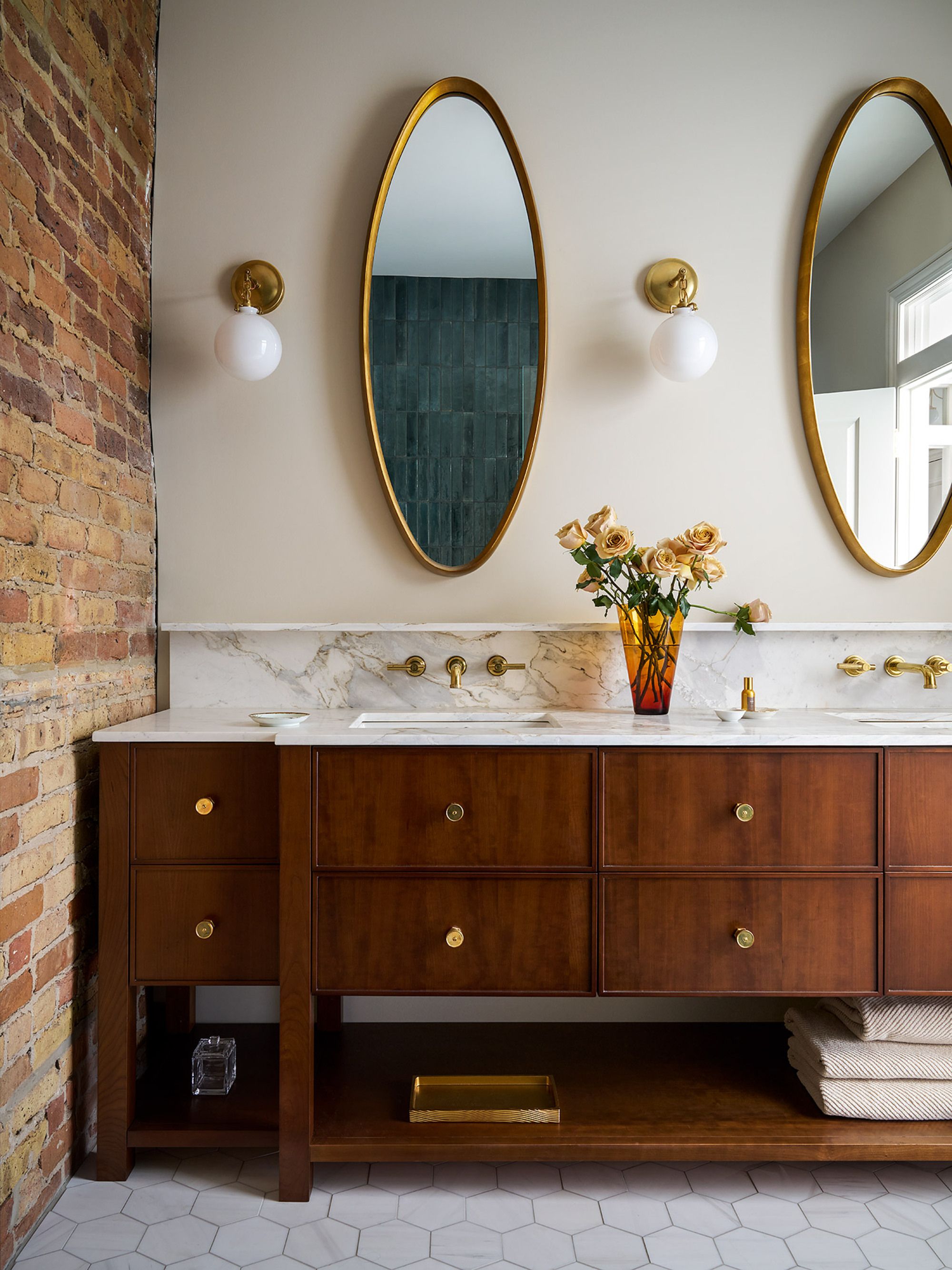 dark wood cabinets with gold fixtures 