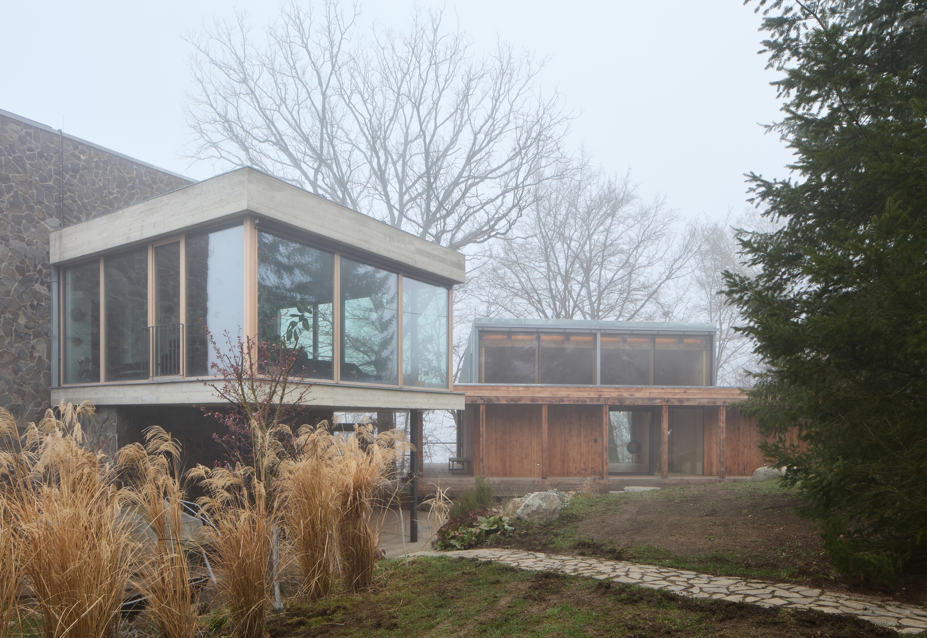 The new studio sits alongside an existing house (left)