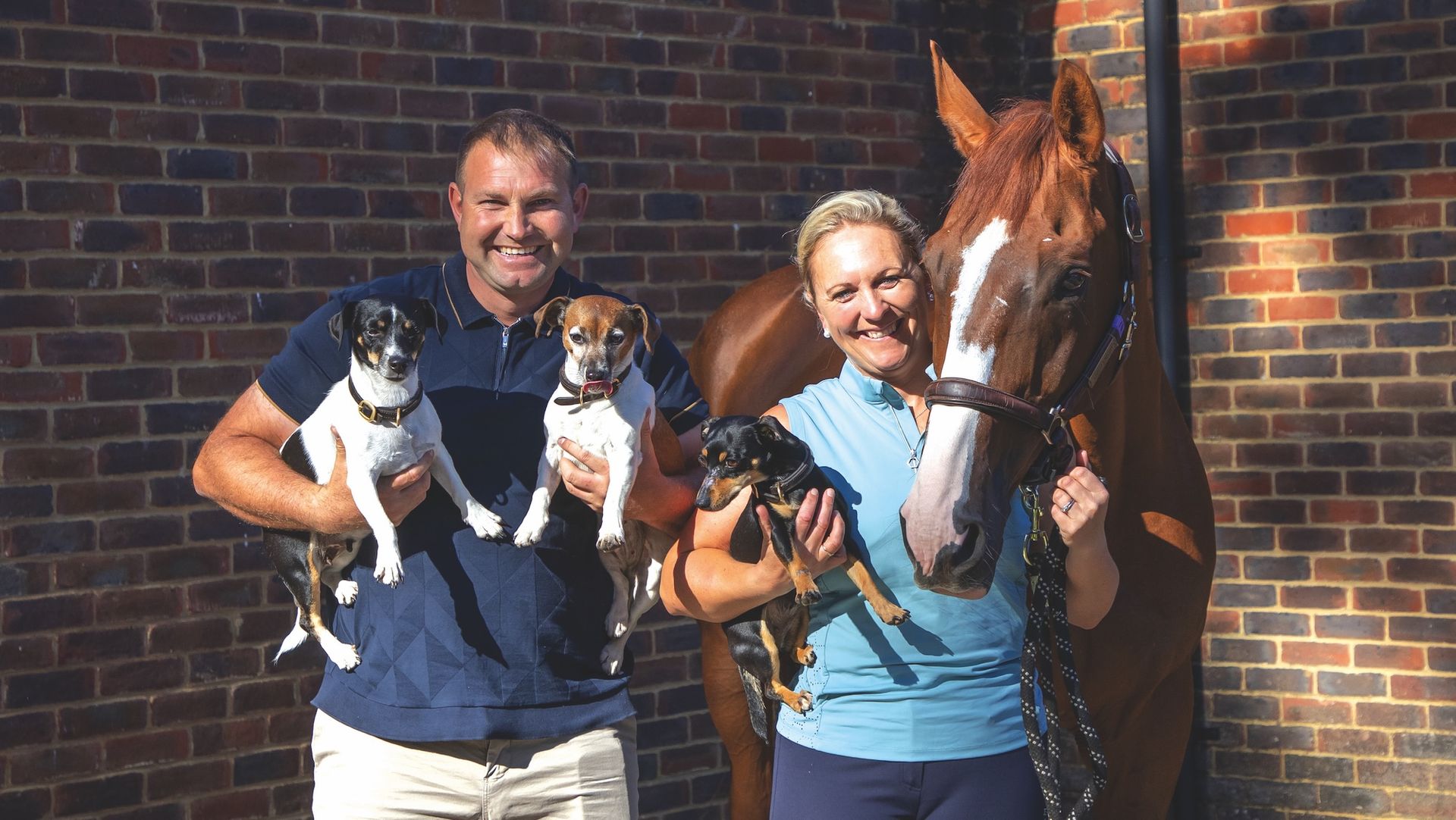 Gary and Gemma Stevens with Chilli Knight and three terriers