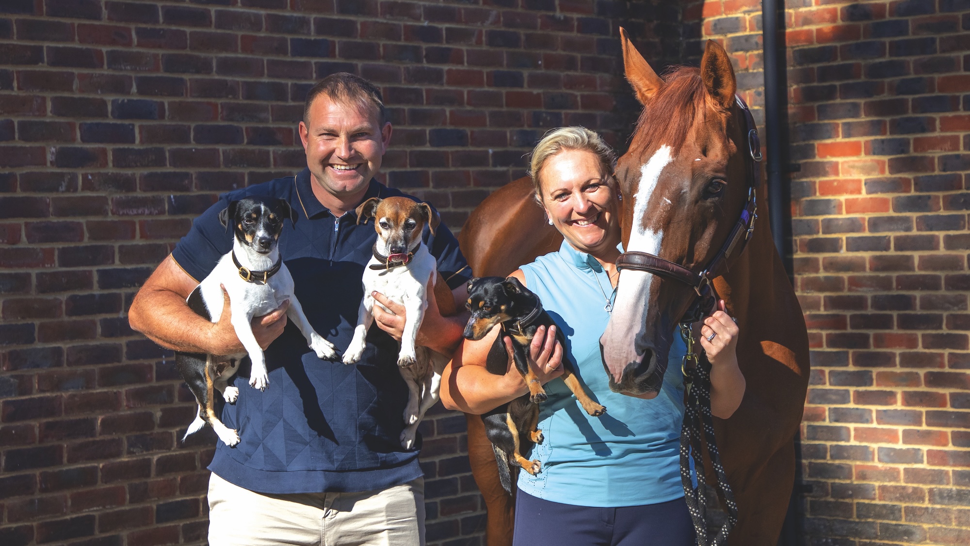 Gary and Gemma Stevens with Chilli Knight and three terriers