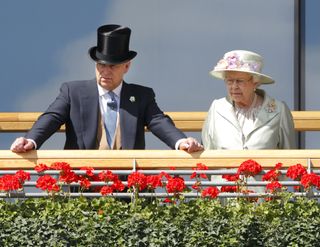 Prince Andrew, Duke of York & Queen Elizabeth II watch the horses in the parade ring as they attend Day 2 of Royal Ascot