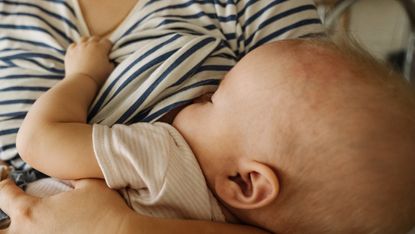 A woman breastfeeding her child 