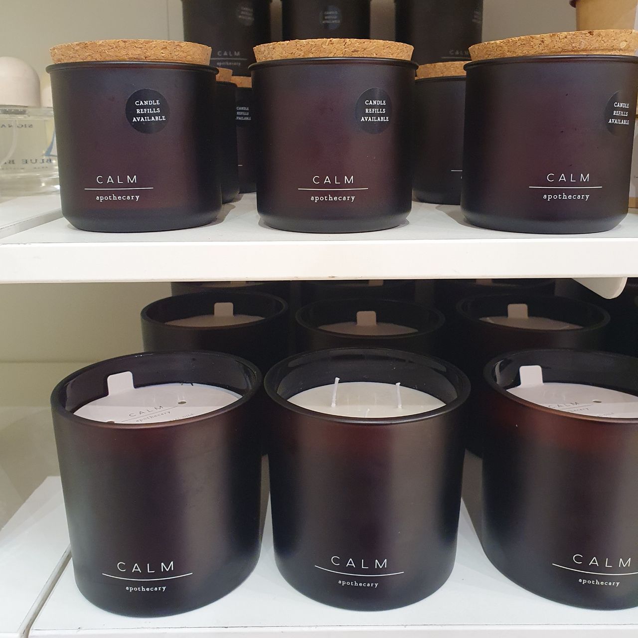 Calm scented candles from Marks &amp; Spencer's Apothecary range displayed at an M&amp;S store