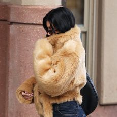 Kylie Jenner wearing a fur jacket