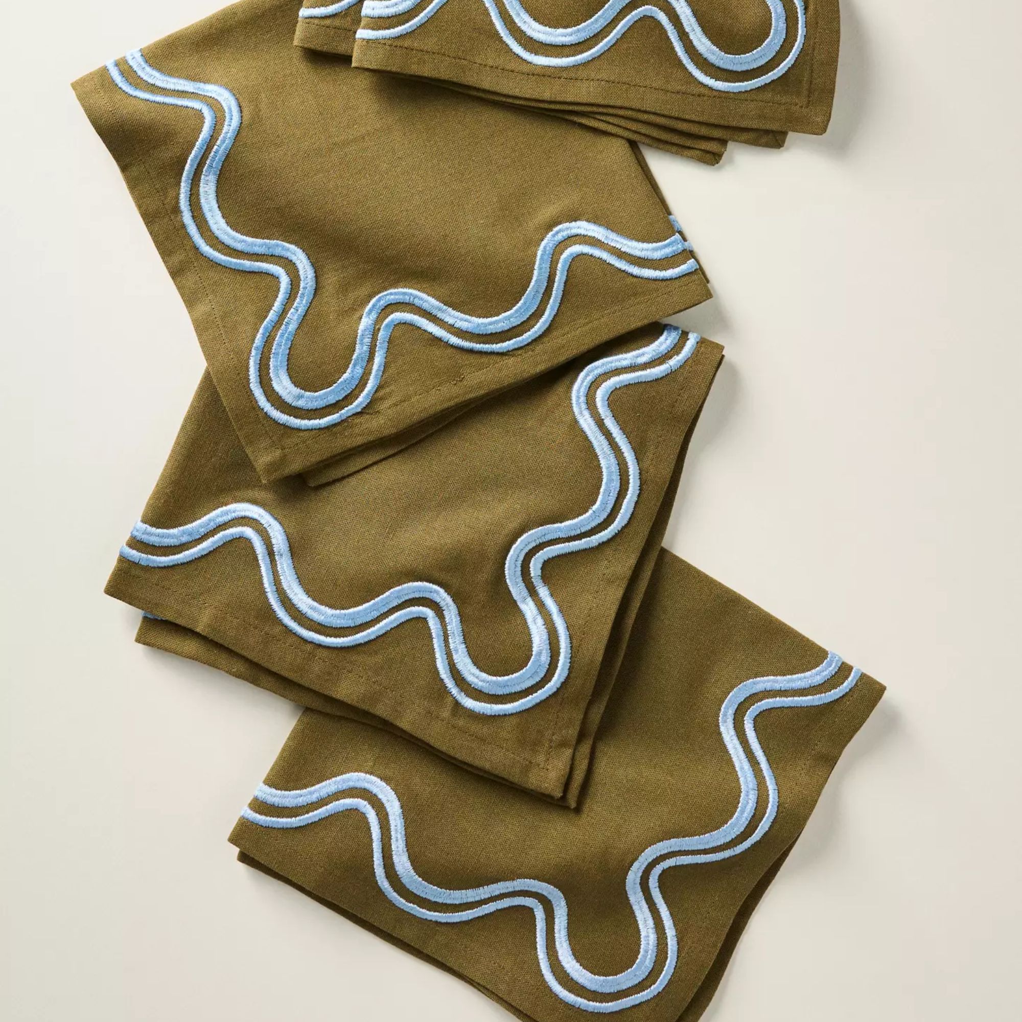 Olive green napkins with blue scalloped trim