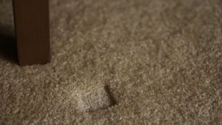 Dent in beige carpet