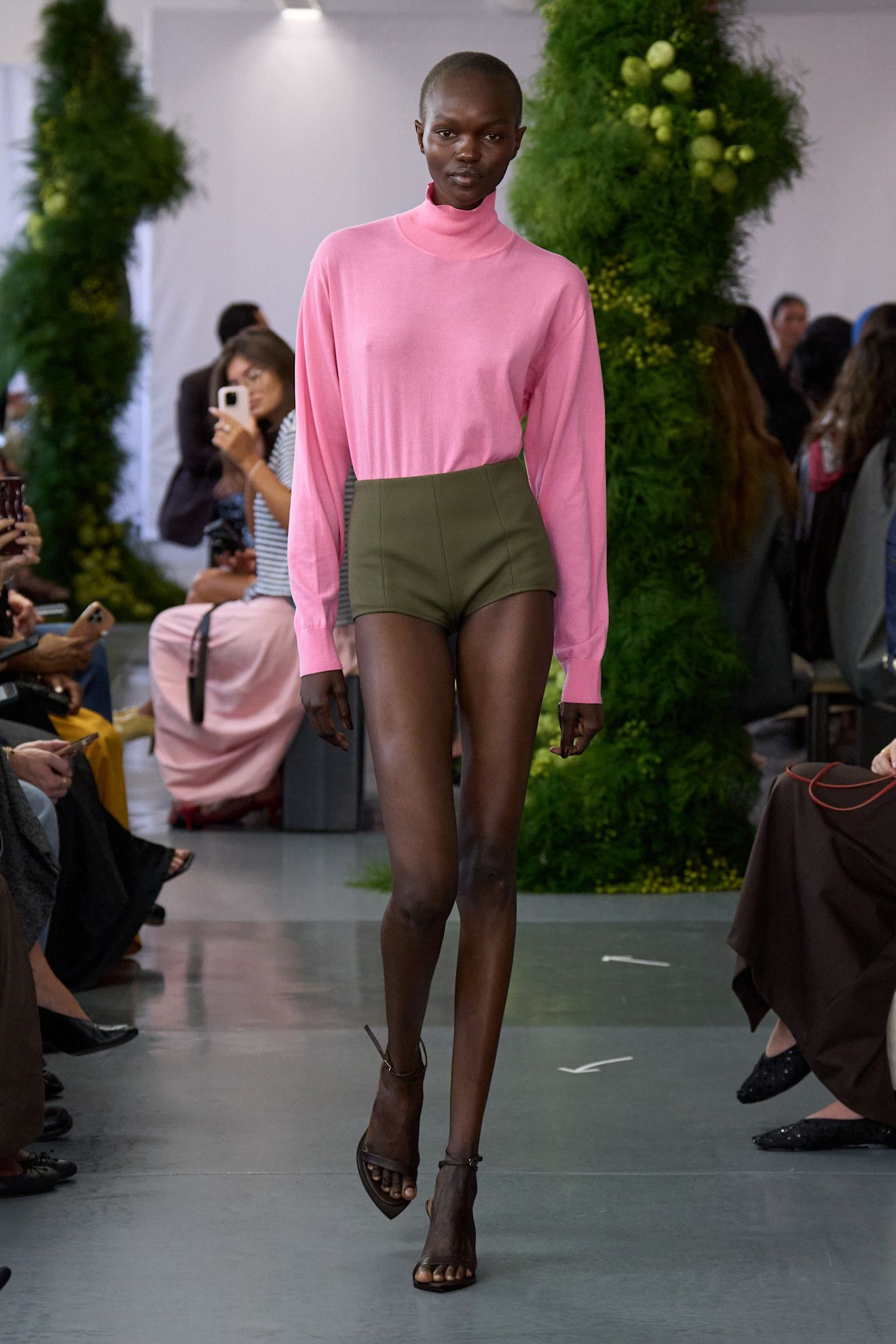 A woman walks down the runway in an unexpected color combination