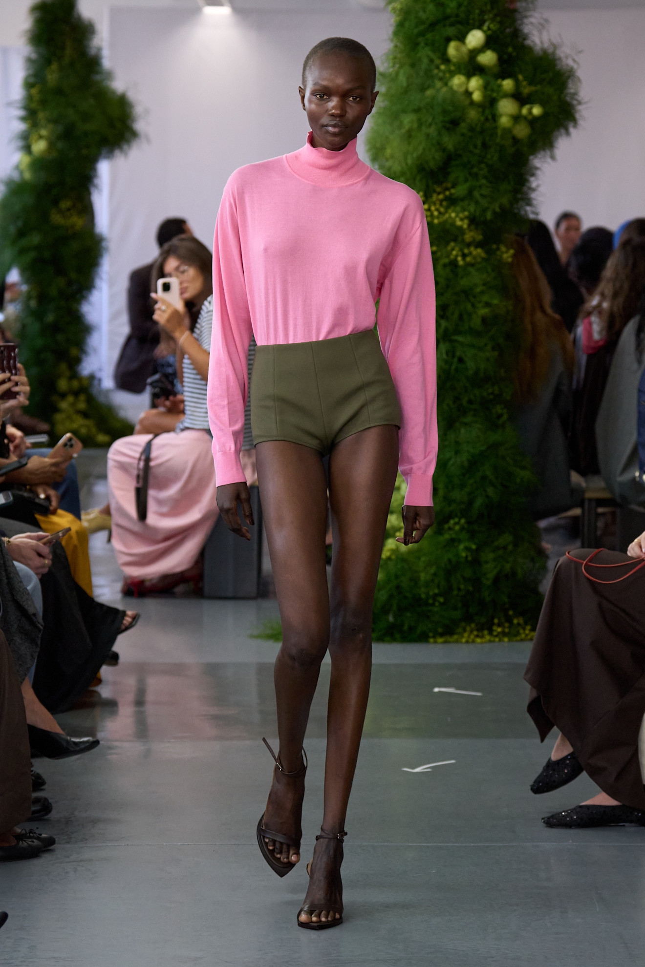A woman walks down the runway in an unexpected color combination