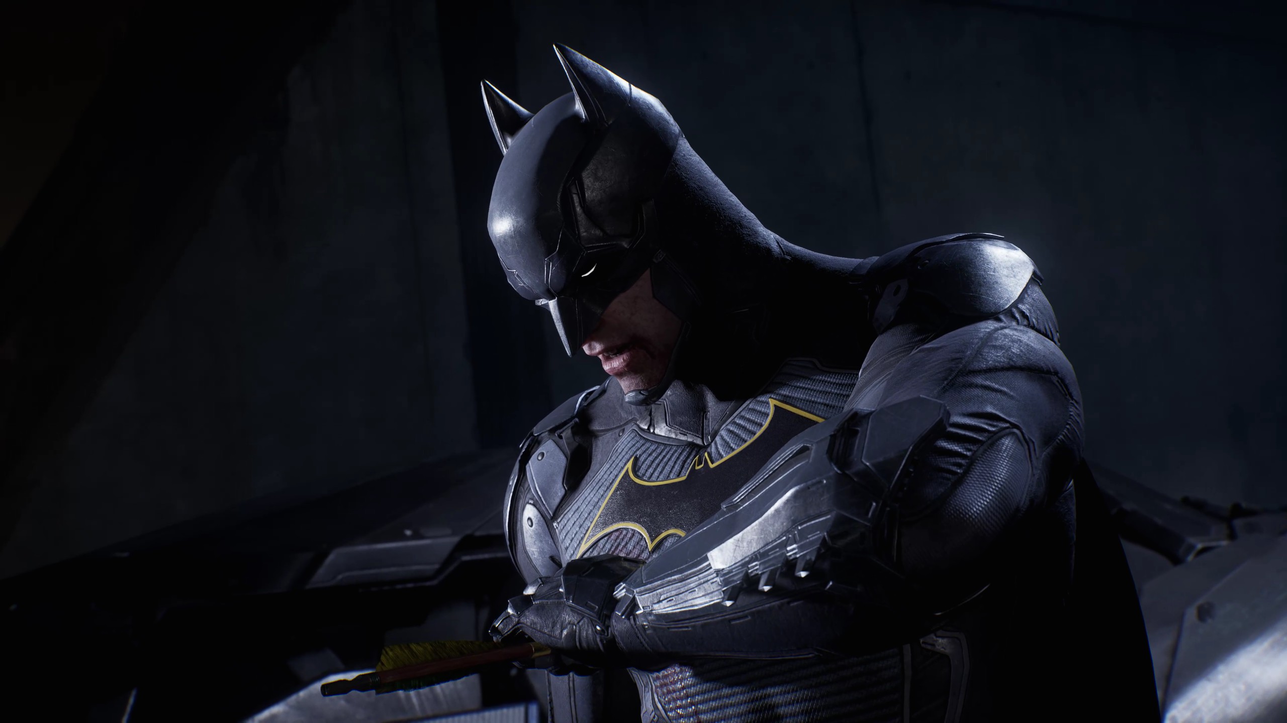 Batman holds an arrow embedded in his chest