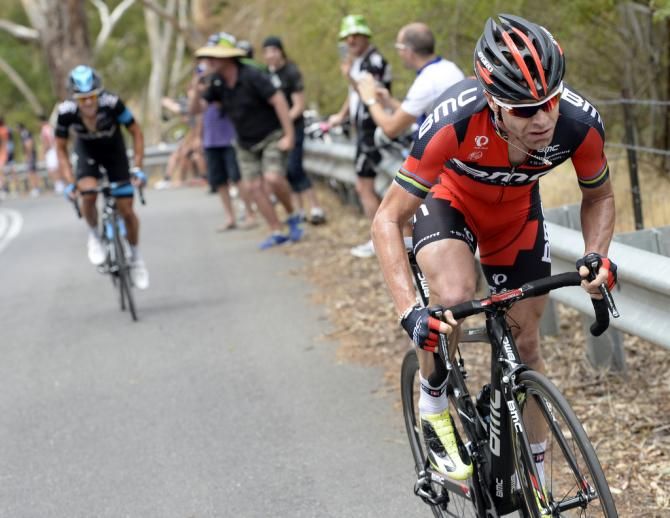 Cadel Evans rides away from Richie Porte on the Corkscrew to take the stage win and leaders jersey