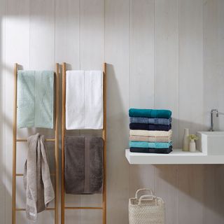 towel with wooden stand and basket