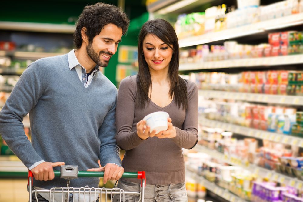 couple reading nutrition labels