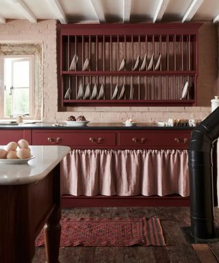 burgundy rustic kitchen with cupboard skirt