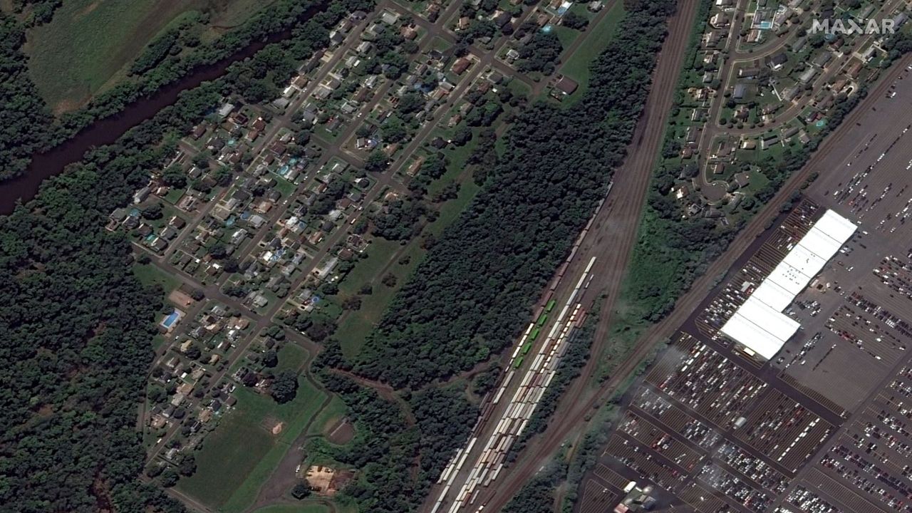 An image from the WorldView-2 satellite shows homes and a railroad line in Manville, New Jersey before the floods, on Aug. 25, 2021.