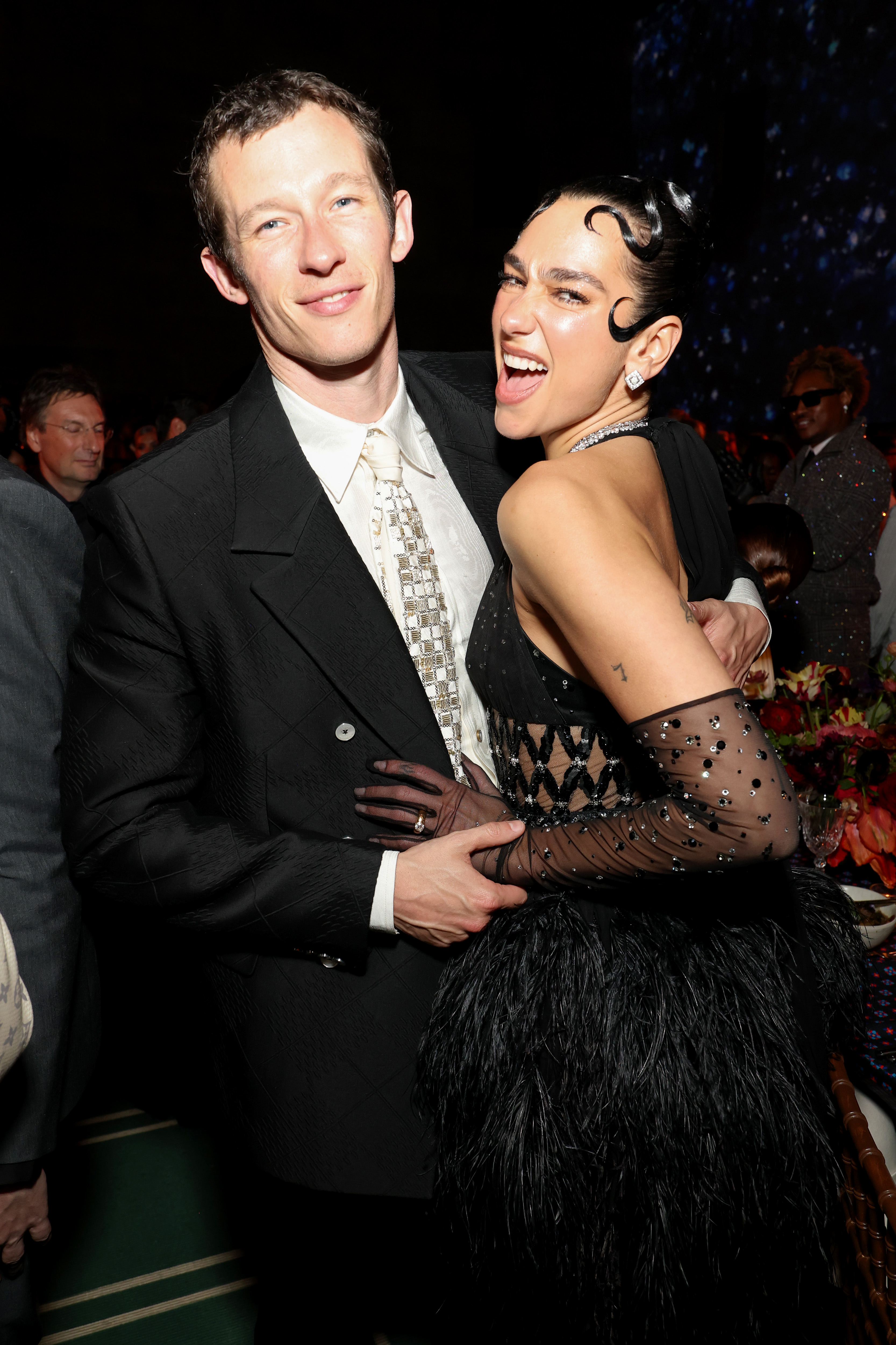 An image of Callum Turner and Dua Lipa, one of the best-dressed celebrity couples from 2015 - 2025.