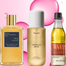 A woman with a high ponytail wearing a white dress, next to three bottles of body oils