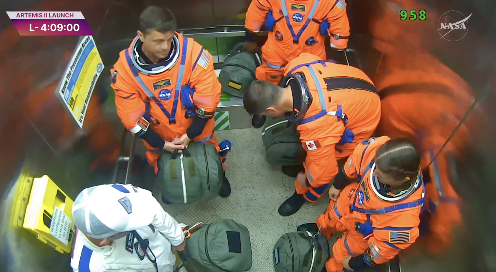 Artemis II crew boards the elevator