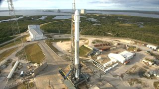 A previously flown SpaceX Falcon 9 booster and Dragon spacecraft stand ready to launch the CRS-13 cargo mission for NASA from Space Launch Complex 40 at Cape Canaveral Air Force Station in Florida. Liftoff is scheduled for Dec. 15, 2017.
