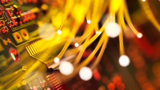 Close up of yellow networking cables going to a circuitboard