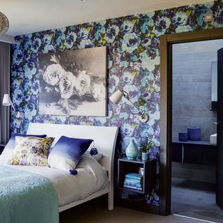 bedroom with wall frame and wallpaper
