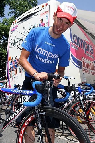 Paolo Tiralongo (Lampre-Fondtial) gives his bike the once over.