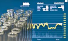 Biotech investing illustration - test tubes overlaid on stock chart