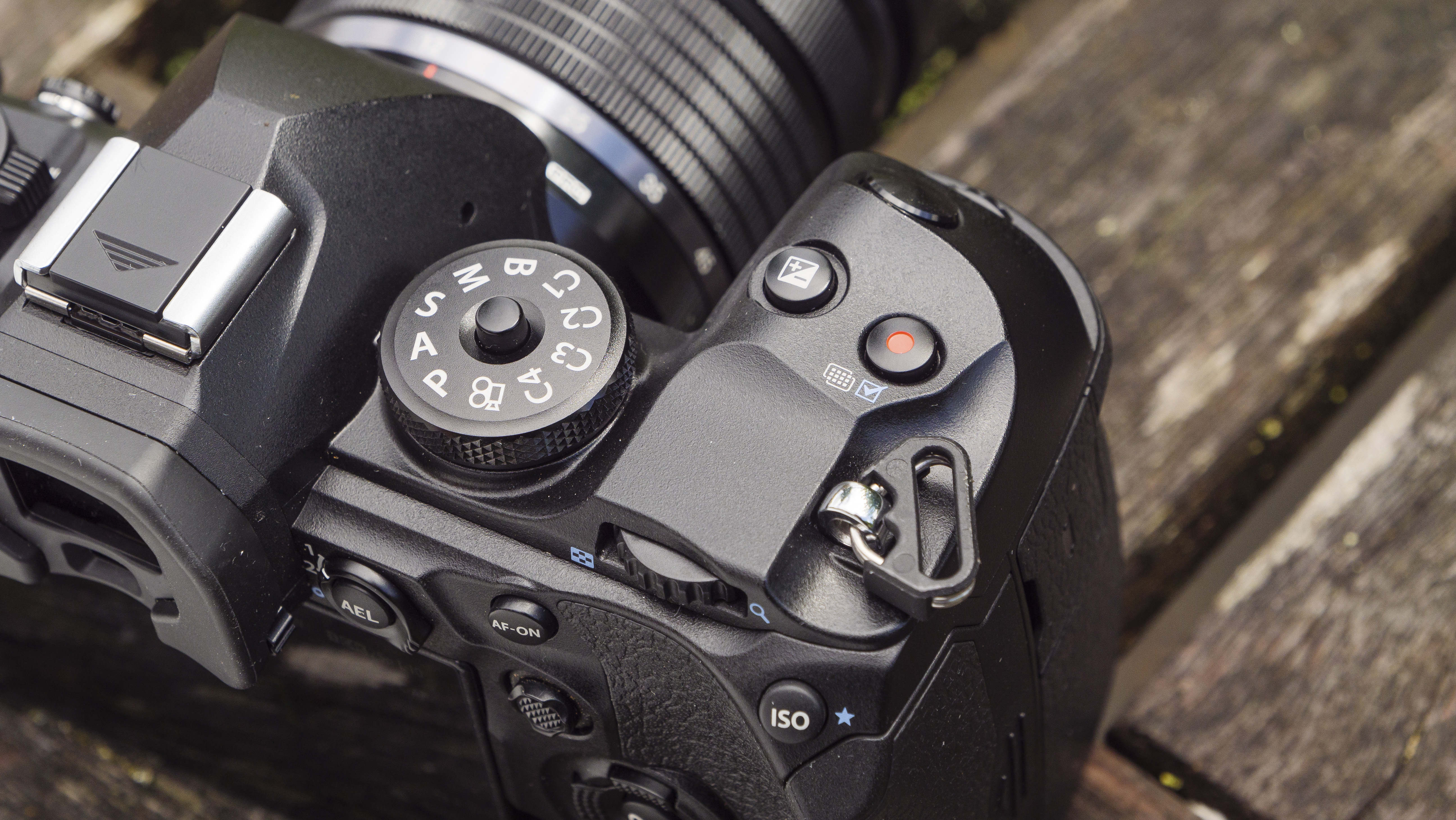 The top dials of the OM System OM-1 camera