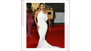 Maya Jama wears a white off the shoulder, long satin gown as she attends the National Television Awards 2022 at OVO Arena Wembley on October 13, 2022 in London, England.