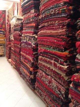 Textile, Red, Public space, Carmine, Maroon, Market, Collection, Human settlement, Retail, Carpet,