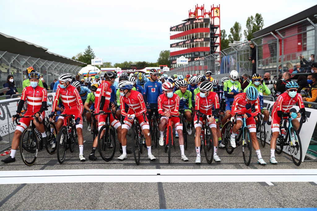 IMOLA ITALY SEPTEMBER 27 Start Jakob Fuglsang of Denmark Niklas Eg of Denmark Jonas Gregaard Wilsly of Denmark Jesper Hansen of Denmark Mikkel Frolich Honore of Denmark Michael Valgren Hundahl of Denmark Christopher Juul Jensen of Denmark Casper Phillip Pedersen of Denmark Tadej Pogacar of Slovenia Peloton Mask Covid Safety Measures Autodromo Enzo e Dino Ferrari during the 93rd UCI Road World Championships 2020 Men Elite Road Race a 2582km race from Imola to Imola Autodromo Enzo e Dino Ferrari ImolaEr2020 Imola2020 on September 27 2020 in Imola Italy Photo by Alex Whitehead PoolGetty Images