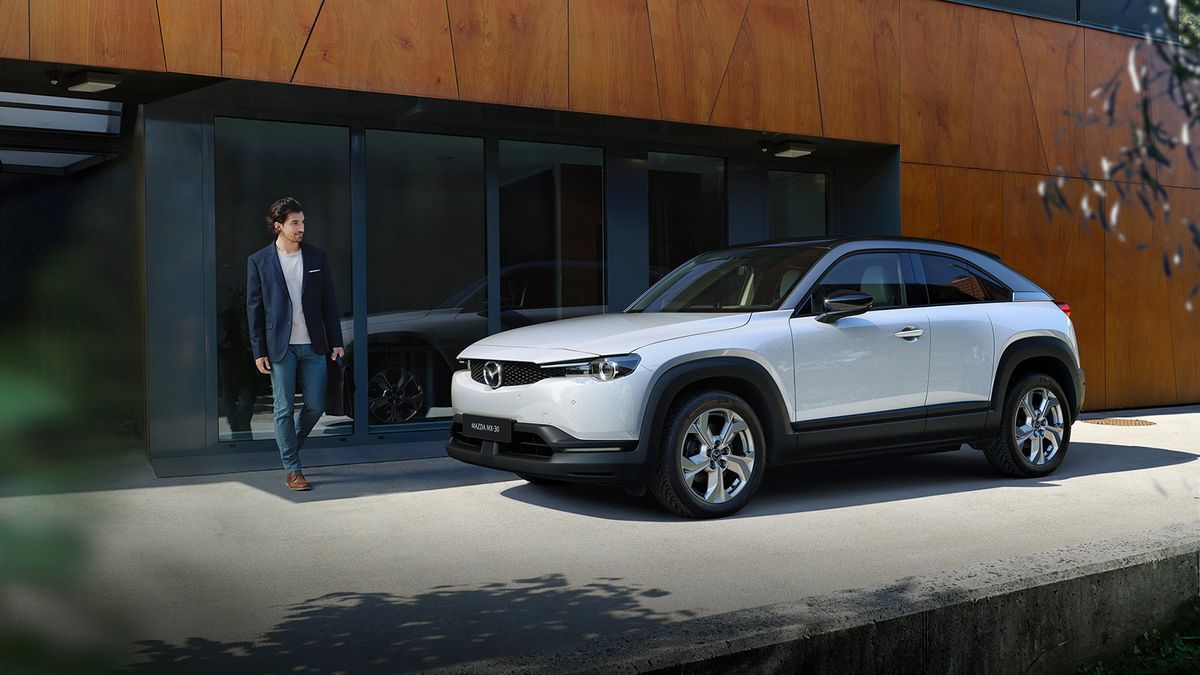 Mazda MX-30 Crossover in front of modern house