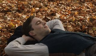 Tolkien Nicholas Hoult laying on leaves