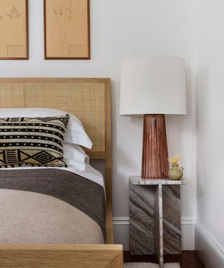 nightstand with lamp in bedroom