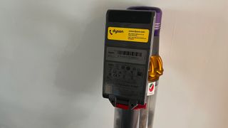 The serial number and model number on the underneath of the battery of the Dyson V15 Detect
