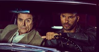 Ricky Whittle and Ian McShane in American Gods.