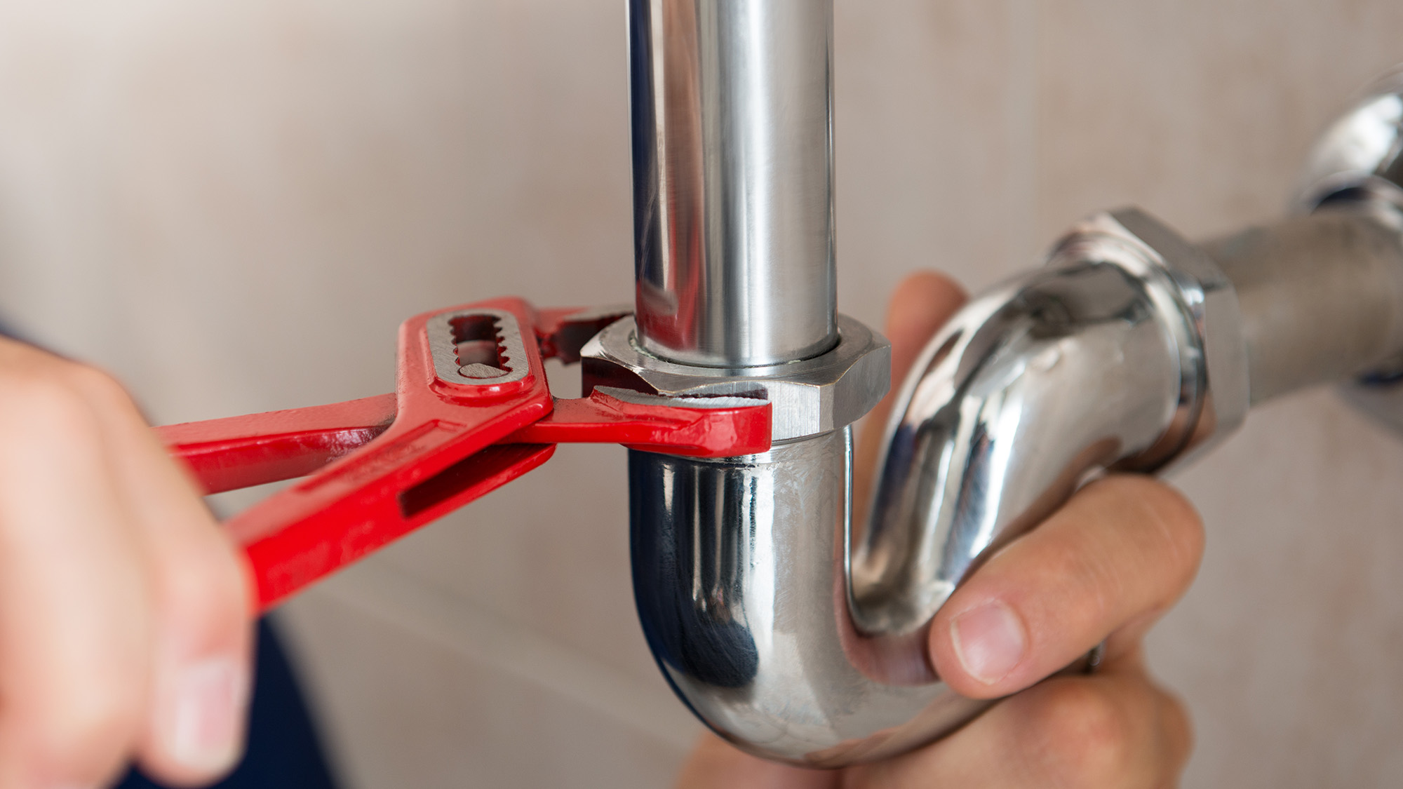 Plumber fixing sink