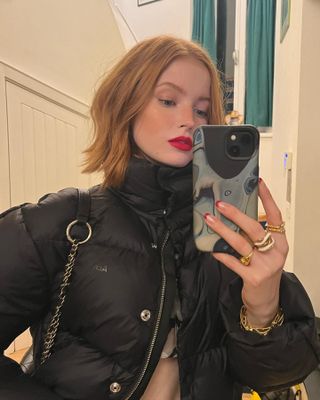 An image of Ellie Bamber with copper hair.