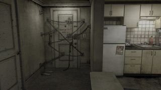 A door covered in locks and chains in Silent Hill 4.