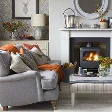 living room with fireplace and sofaset with cushions