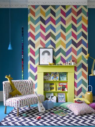 bright nursery decorating scheme with geometric wallpaper