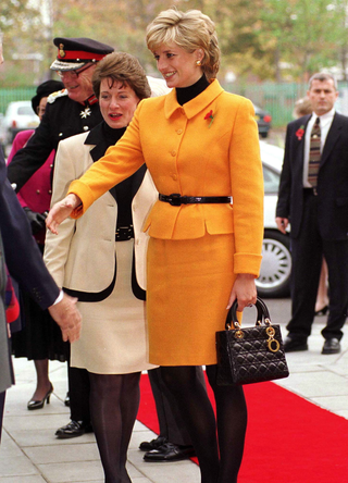 Princess Diana Arriving At The Liverpool Women's Hospital, Merseyside. Her Suit Is By Versace And Her Handbag By Dior